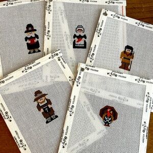 Group of five needlepoint canvases